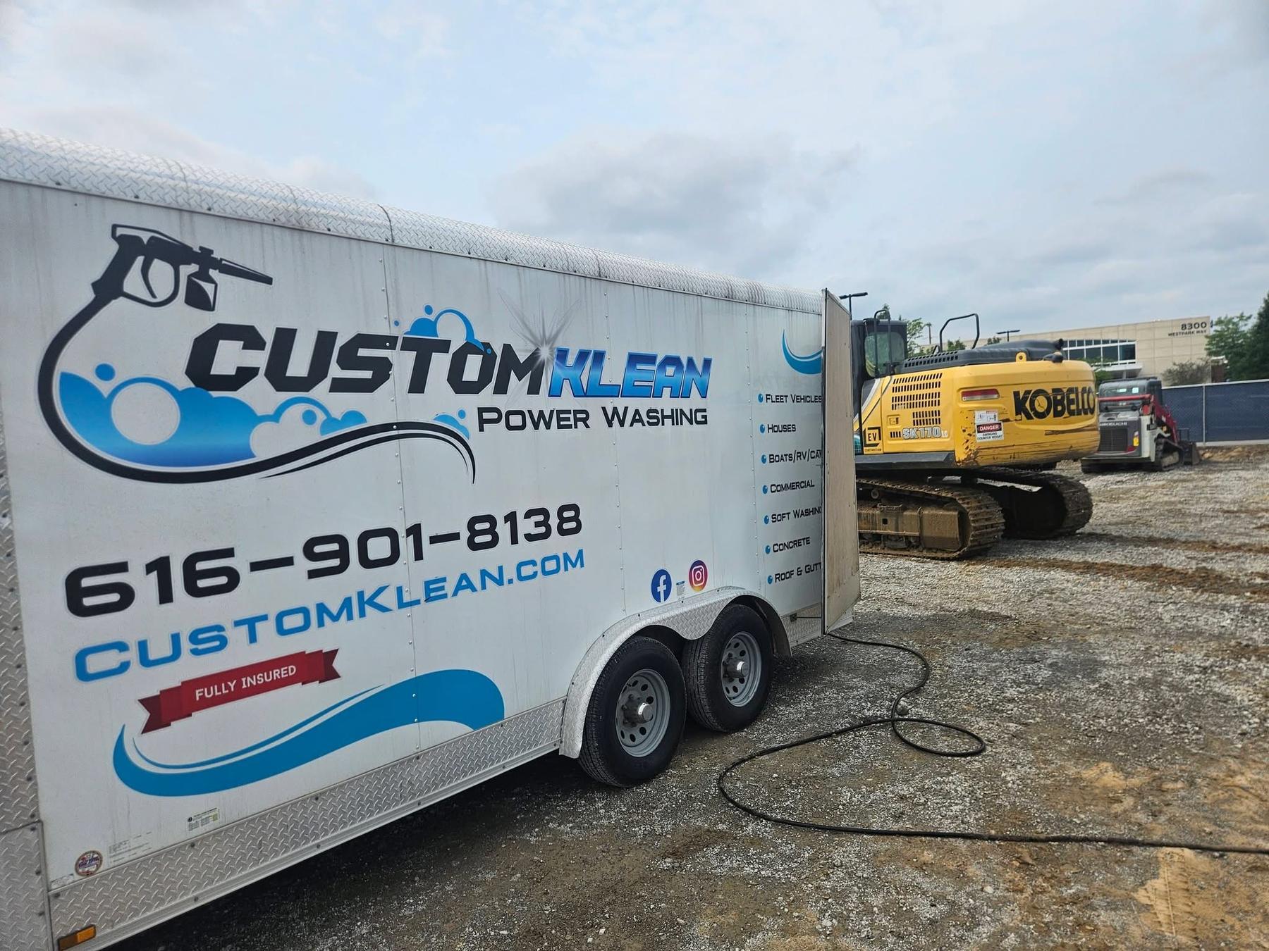 Custom Klean Power Washing branded equipment trailer with logo, phone number, and services list