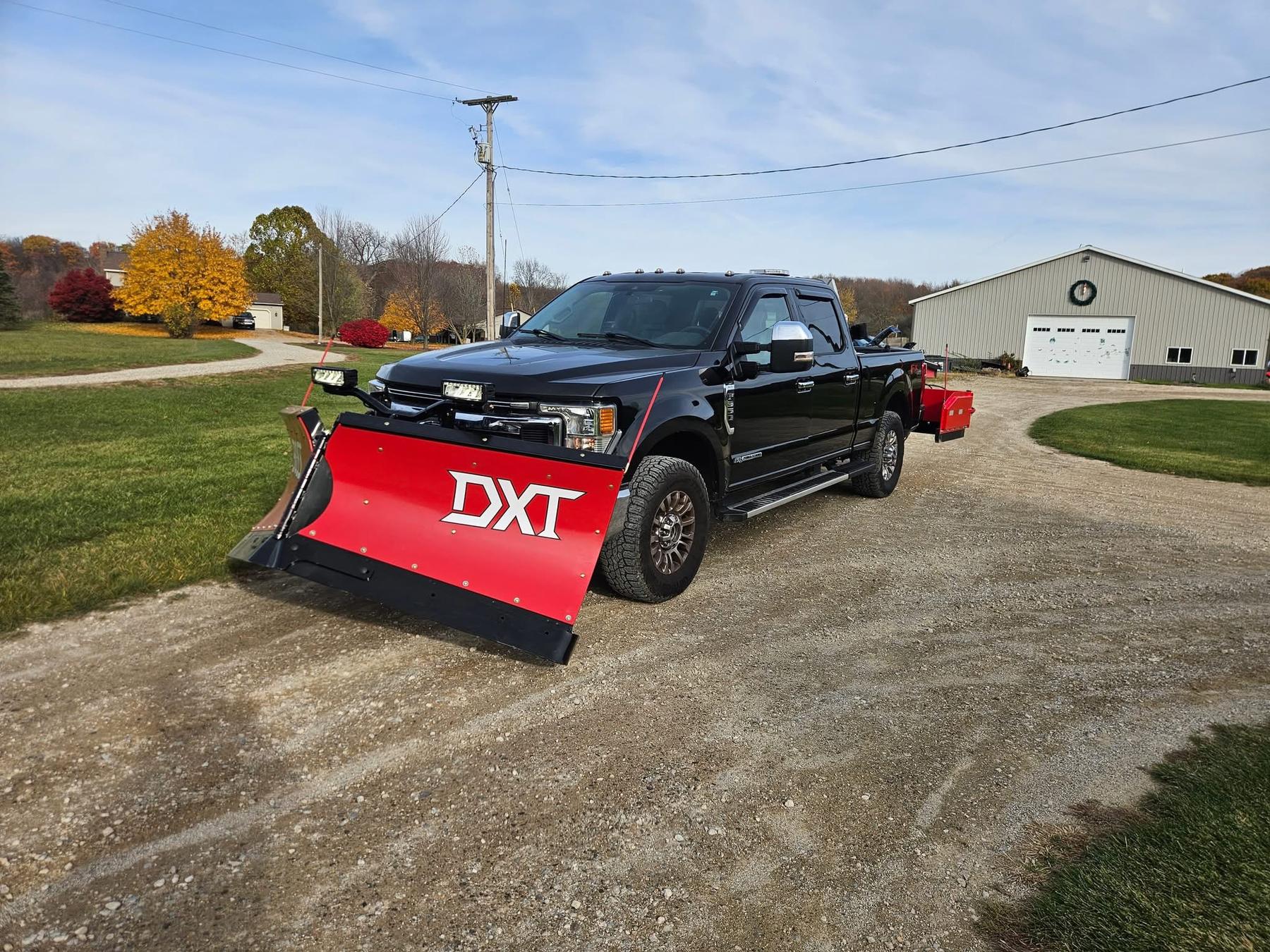 Custom Klean truck with DXT snow plow attachment ready for winter snow removal